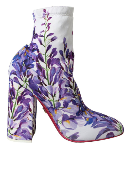 a pair of shoes with purple flowers painted on them