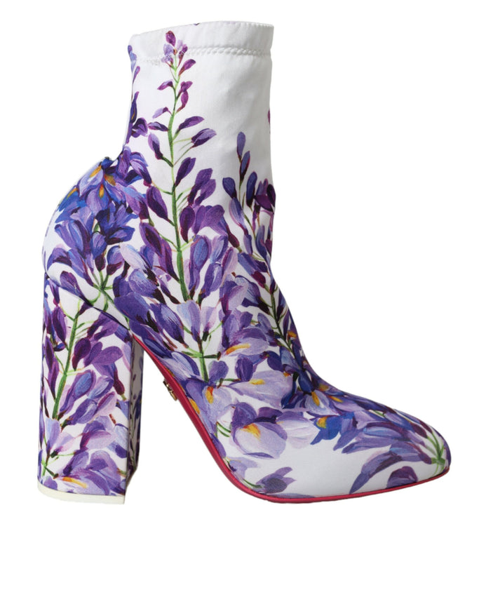 a pair of shoes with purple flowers painted on them