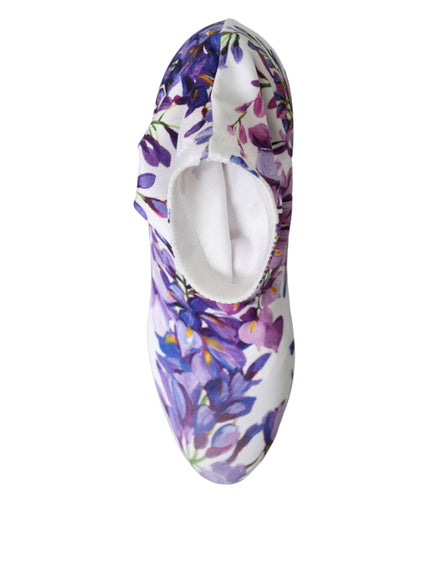 a pair of slippers with purple flowers on them