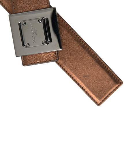 a brown belt with a metal buckle on it