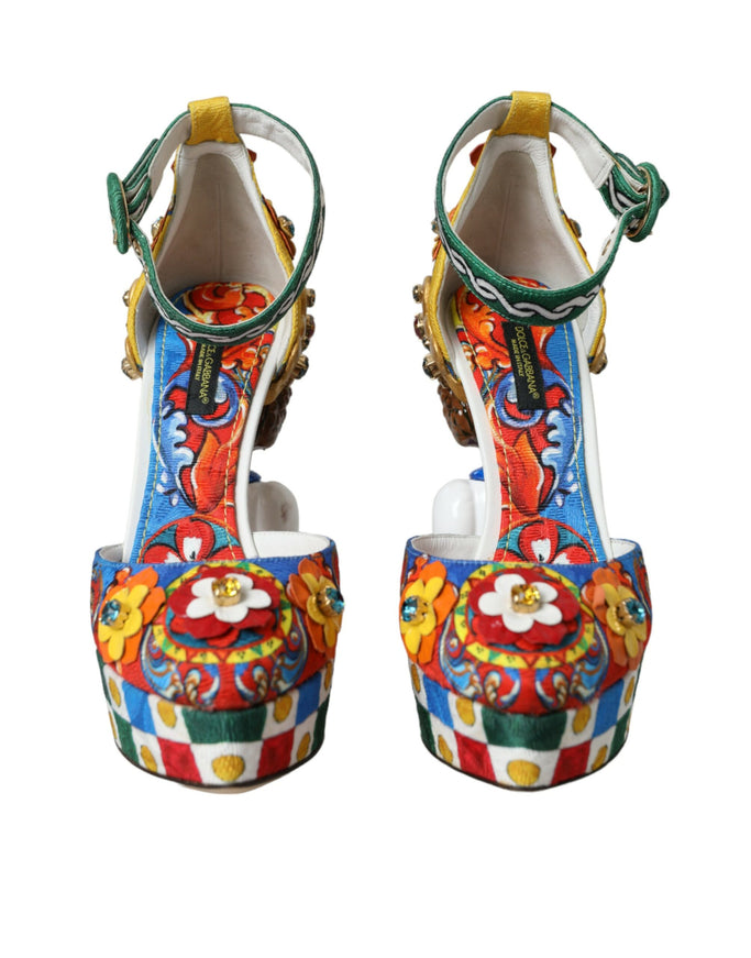 a pair of colorful high heeled shoes on a white background