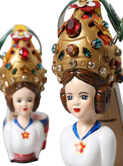 a close up of two figurines wearing crowns