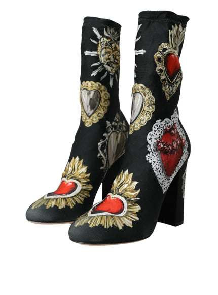 a pair of black high heeled shoes with hearts and sunflowers