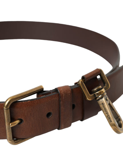 a brown leather belt with brass buckles