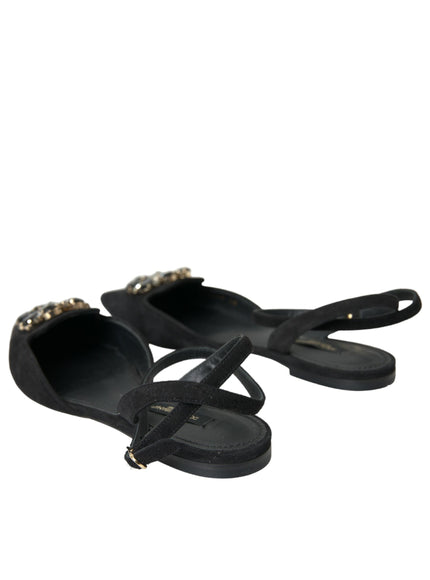 a pair of black sandals with chains on them