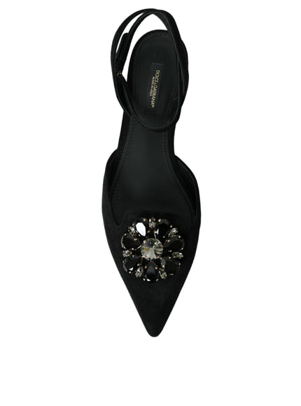 a pair of black shoes with a jeweled heel