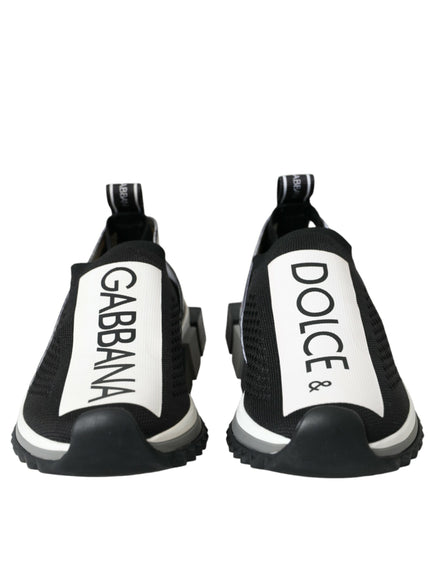 a pair of black and white shoes with the words dolce on them