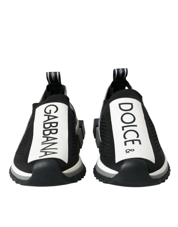 a pair of black and white shoes with the words dolce on them