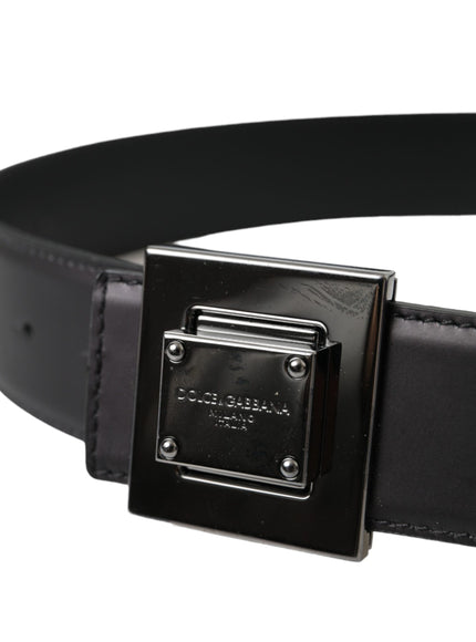 a black leather belt with a square buckle