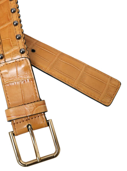 a tan leather belt with a metal buckle