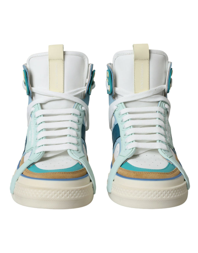 a pair of white and blue sneakers on a white background