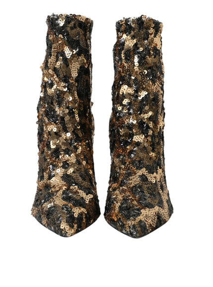 a pair of black and gold sequin boots