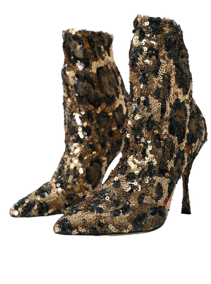 a pair of high heeled boots with sequins