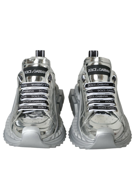 a pair of silver sneakers on a white background