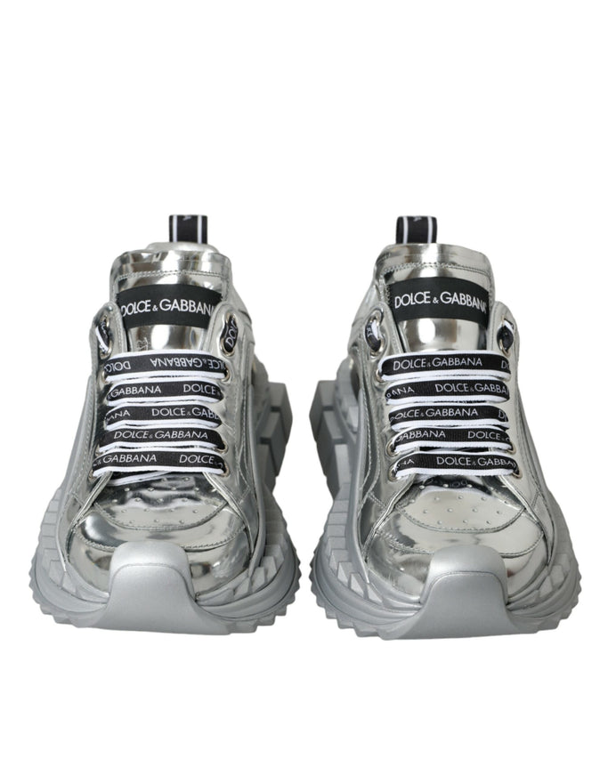 a pair of silver sneakers on a white background