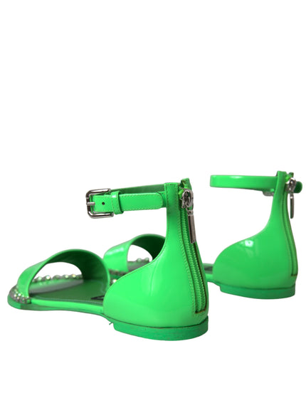 a pair of green shoes on a white background