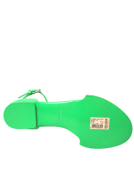 a green shoe with a tag on it