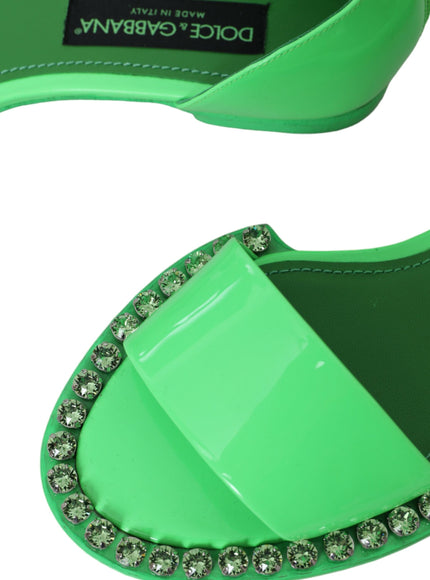 a pair of green shoes with crystals on them