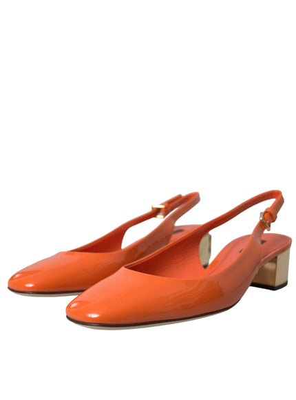 a pair of orange shoes on a white background