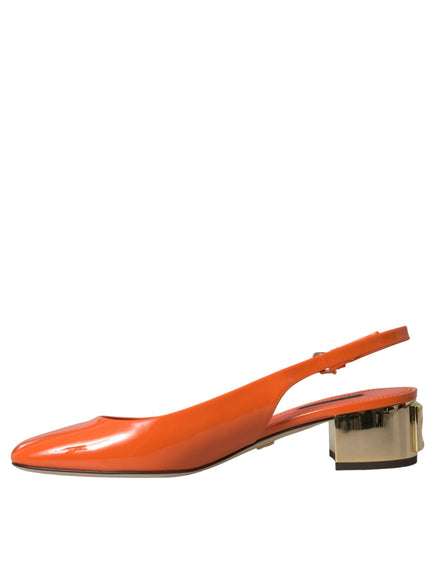 a pair of orange shoes on a white background