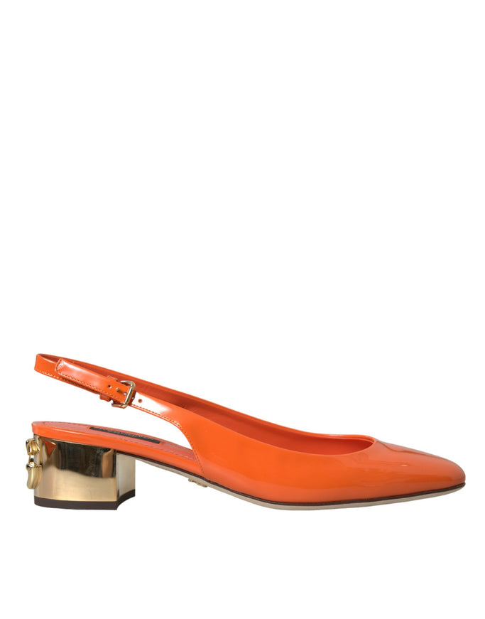 a pair of orange shoes on a white background