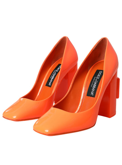 a pair of orange high heeled shoes