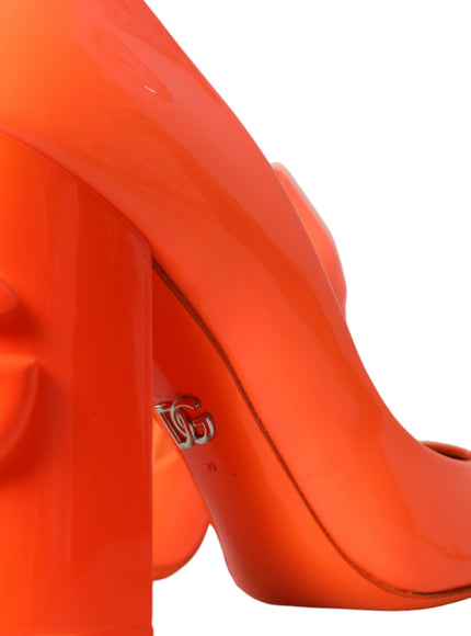 a close up of a pair of orange high heels