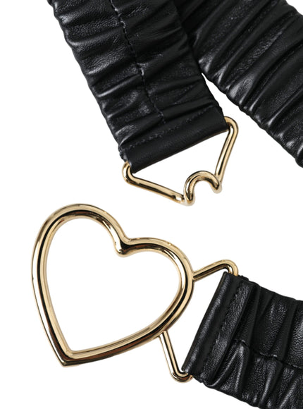 a pair of black leather heart clips