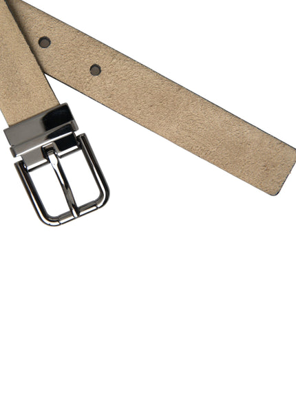 a belt with a metal buckle on a white background