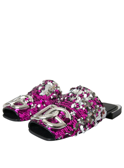 a pair of pink and silver slippers on a white background