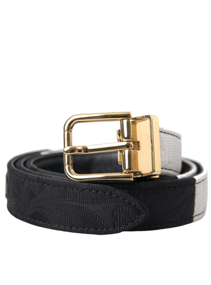 a black and white belt with a gold buckle