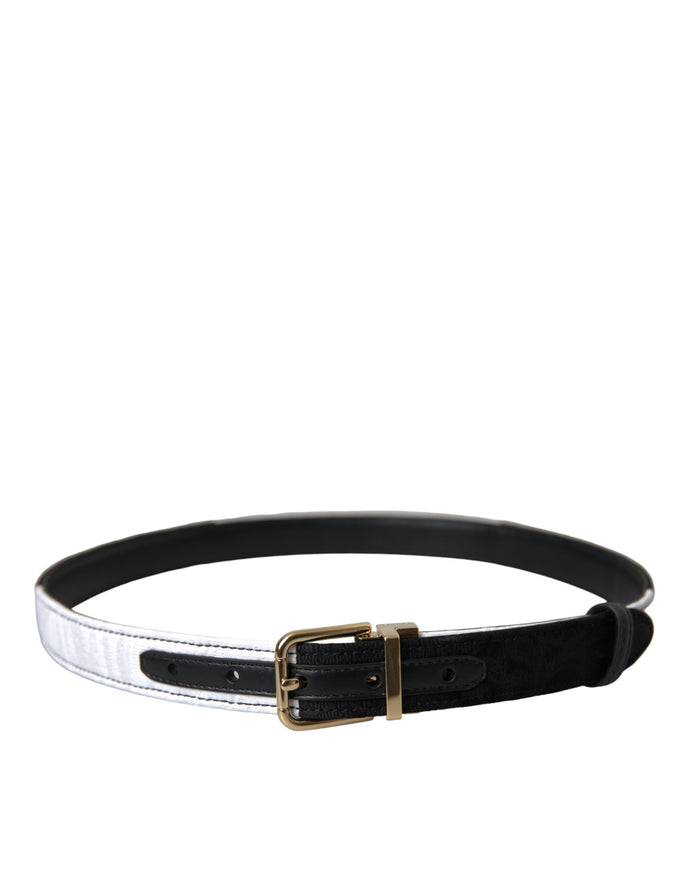 a black and white belt with a gold buckle