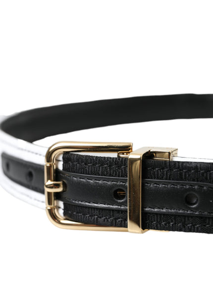 a black and white belt with a gold buckle