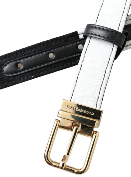 a black and white belt with a gold buckle