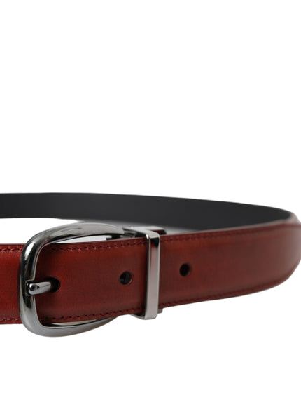 a leather belt with a metal buckle on a white background