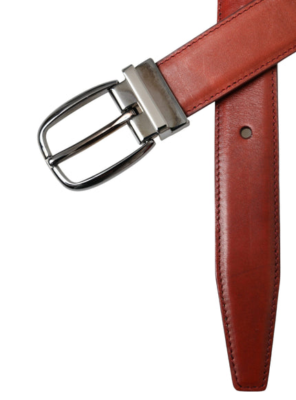 a leather belt with a metal buckle on a white background