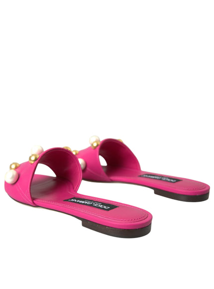 a pair of pink sandals with pearls on the toes