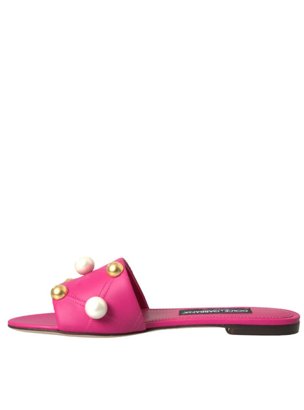 a pair of pink sandals with pearls on them