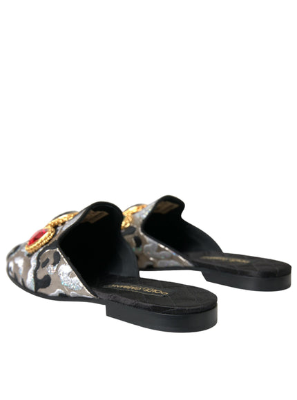 a pair of black and silver slippers