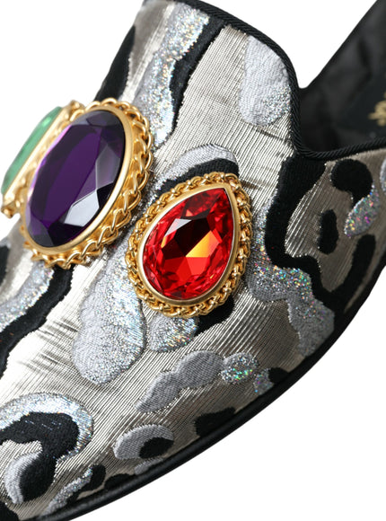 a pair of shoes with jewels on them