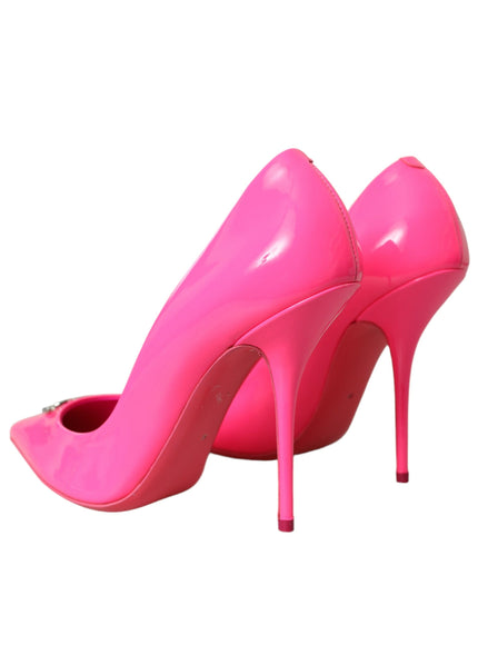 a pair of pink high heels on a white background