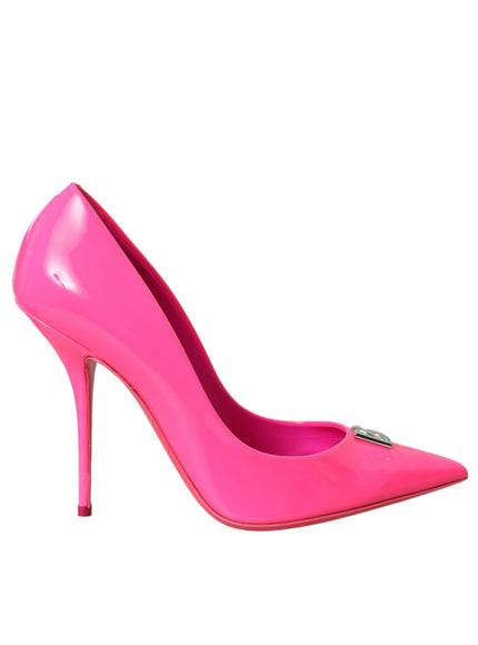 a pink high heeled shoe with a metal buckle