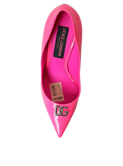 a pink high heel shoe with a tag on the heel