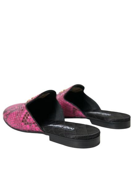 a pair of pink and black shoes on a white background