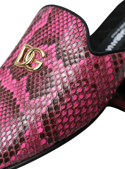 a pair of pink and black shoes with a gold buckle