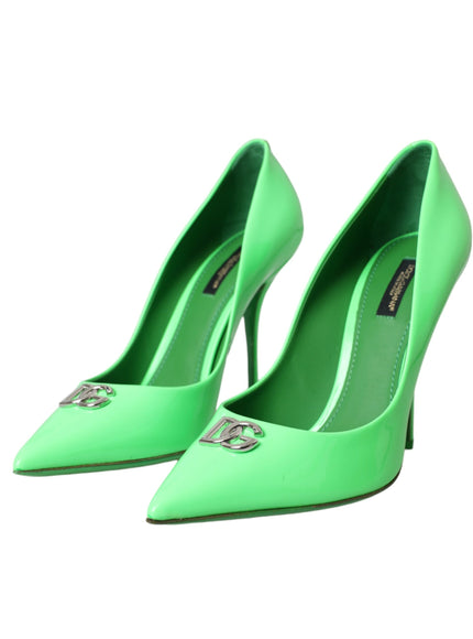 a pair of green high heels on a white background