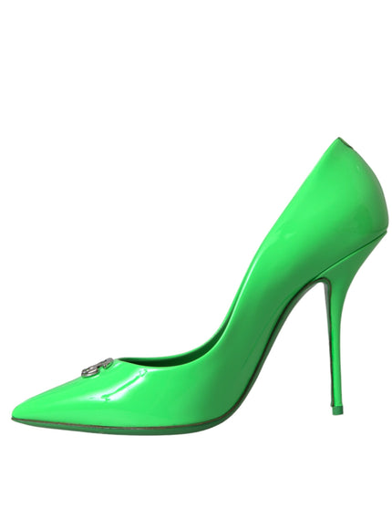 a green high heeled shoe on a white background