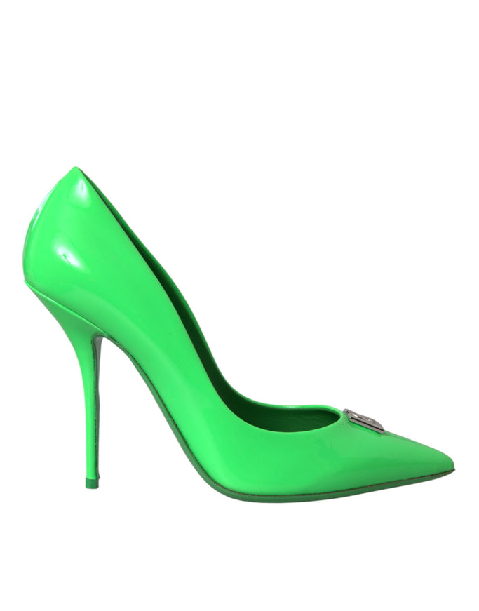 a green high heeled shoe with a zipper