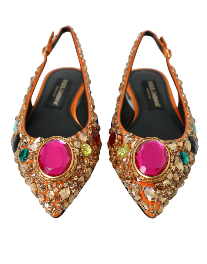 a pair of high heeled shoes with colorful stones