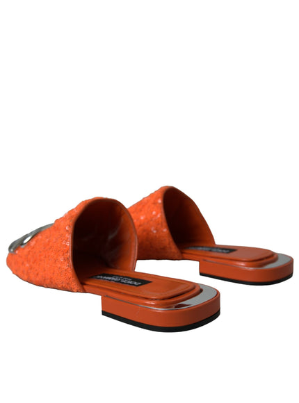 a pair of orange slippers sitting on top of each other